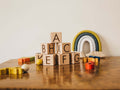 Set of 7 Tiny Maker Mind laser etched wooden alphabet block toys made of natural maple wood 
